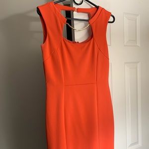 JLo orange fitted dress.